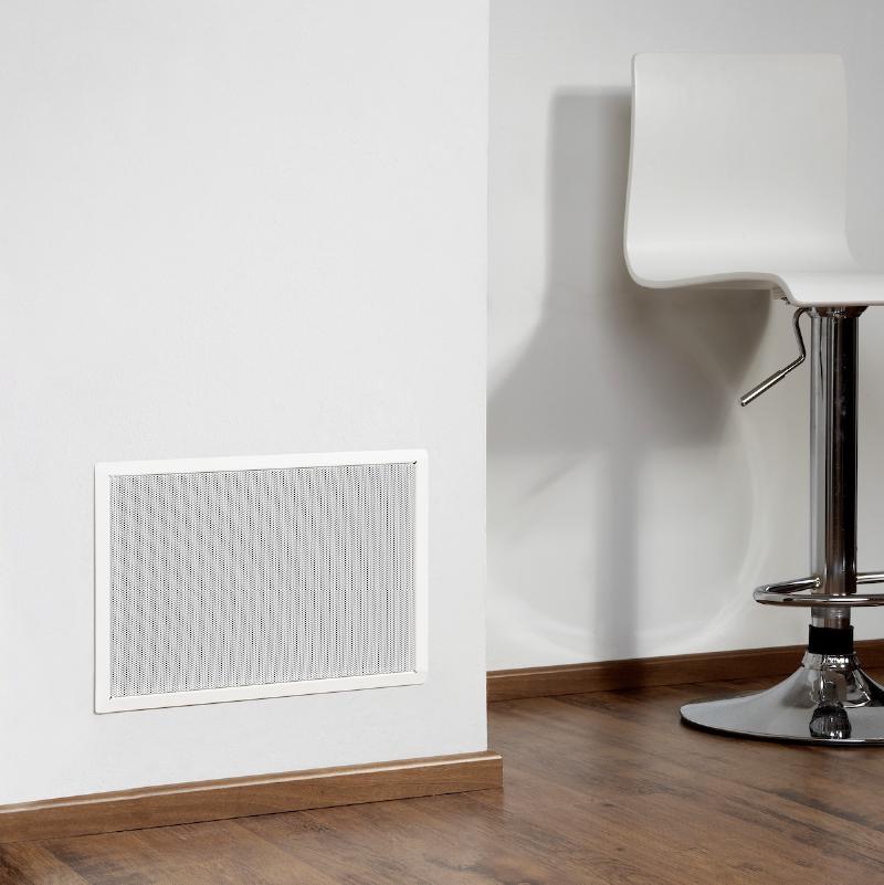 A Genelec 5041A in-wall subwoofer flush-mounted in a wall, providing a discreet bass solution