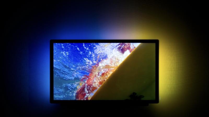 A coloured bias lighting kit producing multi-coloured light behind a TV
