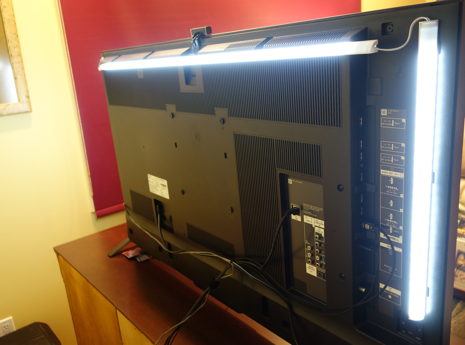 A DIY fluorescent tube bias lighting setup behind a TV