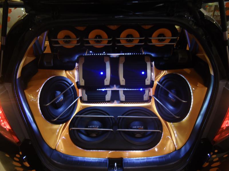 An over-the-top car audio system filling the boot of a Honda Jazz