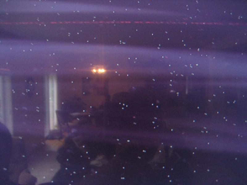 A TV screen showing static-like snow caused by a defective HDMI cable