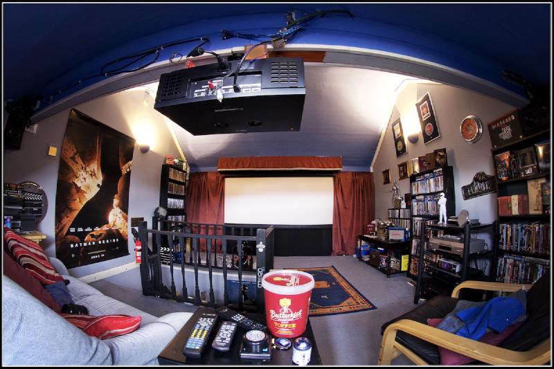 A home theatre featuring an extra-wide 2.40:1 aspect ratio projection screen giving a cinematic widescreen experience
