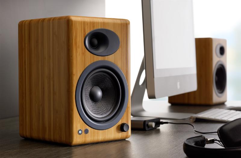 A pair of Audioengine A5+ self-powered bookshelf speakers in Bamboo