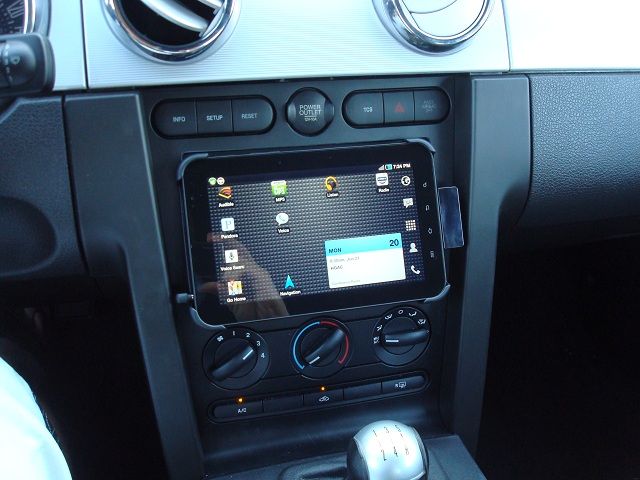 An integrated tablet dock mounted in a car dashboard