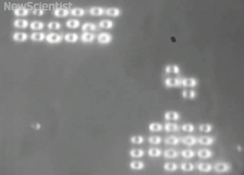 Microscopic Tetris game played using optical tweezers and glass beads