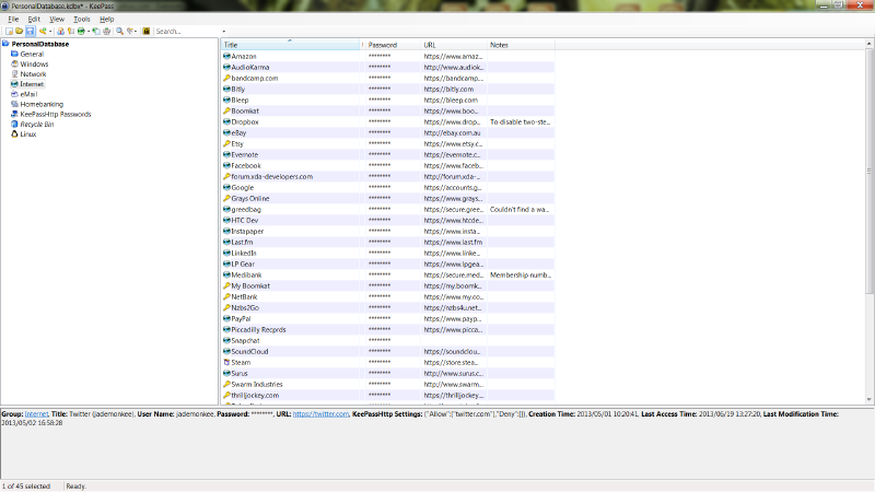 The KeePass main screen showing a list of password entries organised by category, with columns for title, username, password, URL and notes