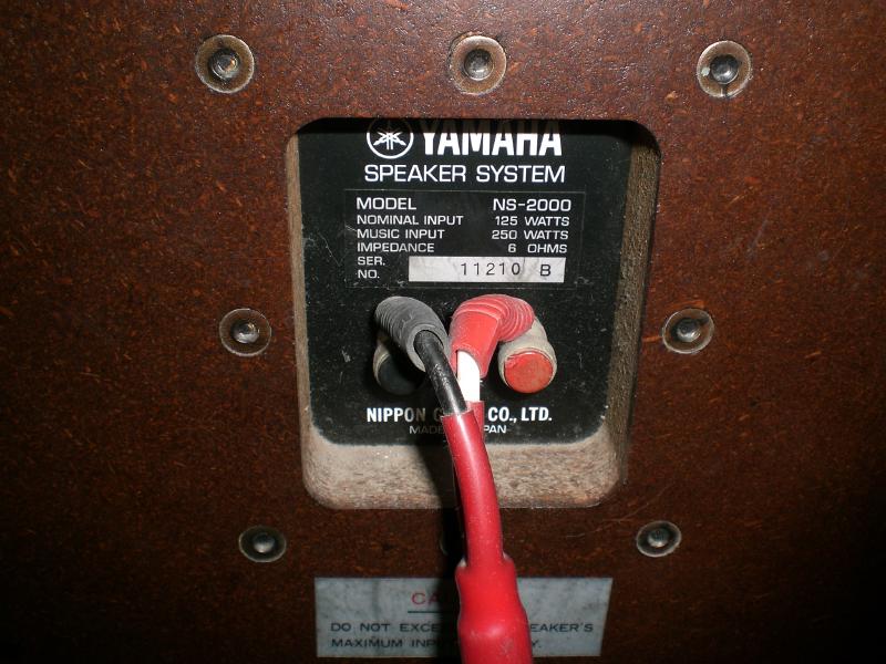 The rear panel of a Yamaha NS-2000 speaker showing the specification label